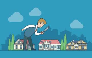 Ein großer Mann schaut mit einer Lupe auf kleine Häuser | Immobilienwertermittlung